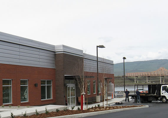 All steel clinic set at the banks of the Columbia River in The Dalles, Oregon.  Design by Stack Architecture.